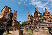 Thailand, Old Sukhothai - Wat Mahathat, the main chedi with a 12-metre-tall statue of standing Buddha on the sides. 